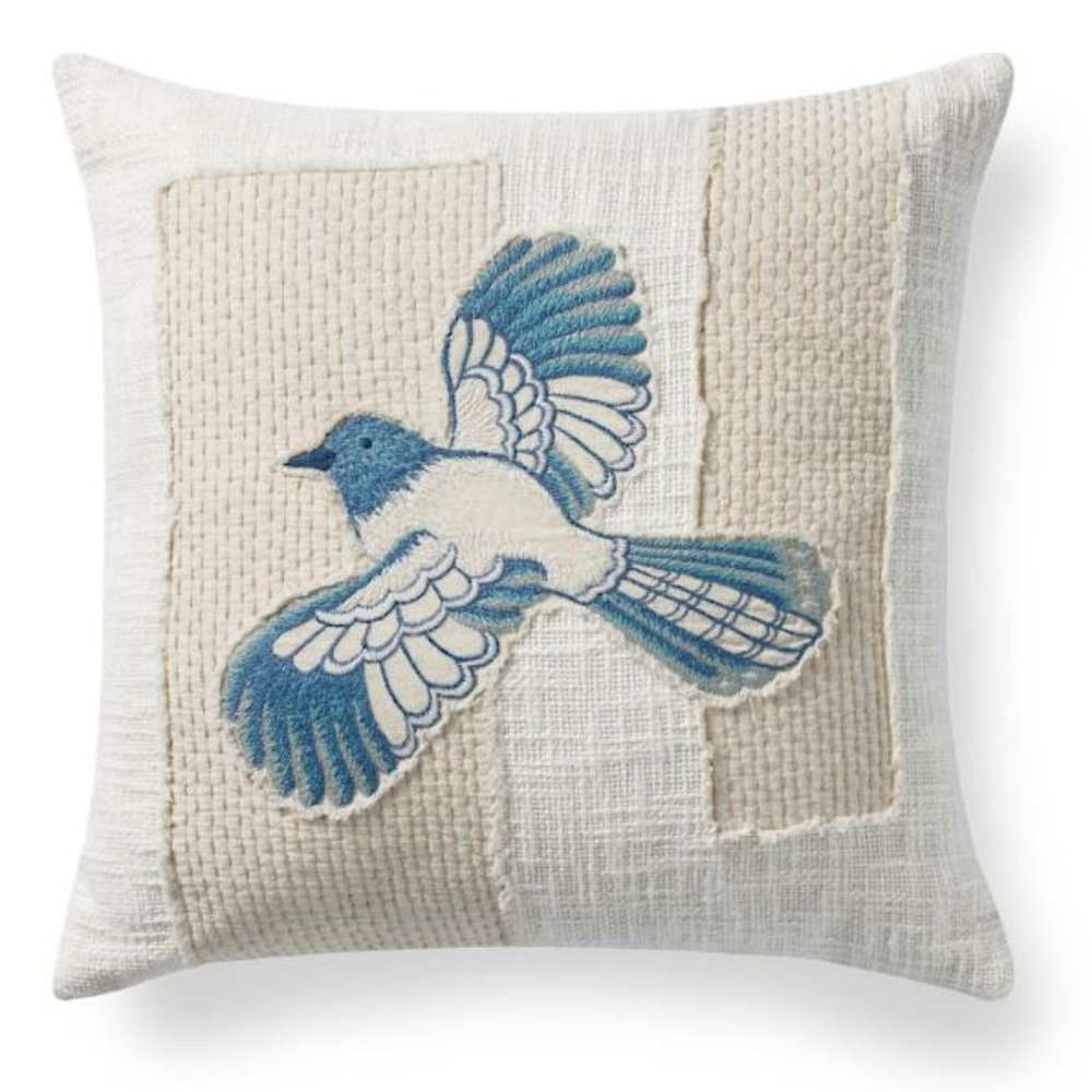 Stitched applique bird throw pillow